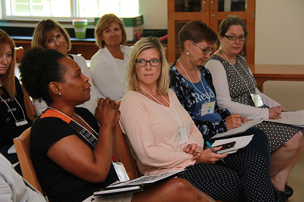 Teachers participating in discussion